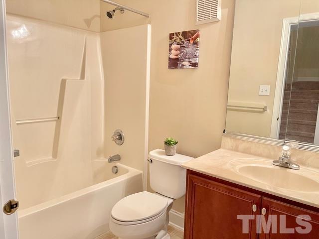 11239 11239th Raleigh, NC 27617 - Photo 21 of 26 a bathroom with a sink a toilet and shower