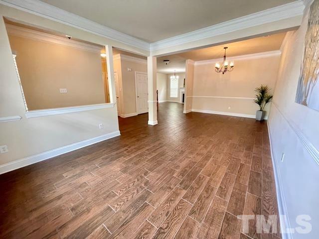 11239 11239th Raleigh, NC 27617 - Photo 4 of 26 a view of empty room with wooden floor and fan