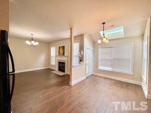 11239 11239th Raleigh, NC 27617 - Photo 9 of 26 a view of a kitchen with furniture and a fireplace