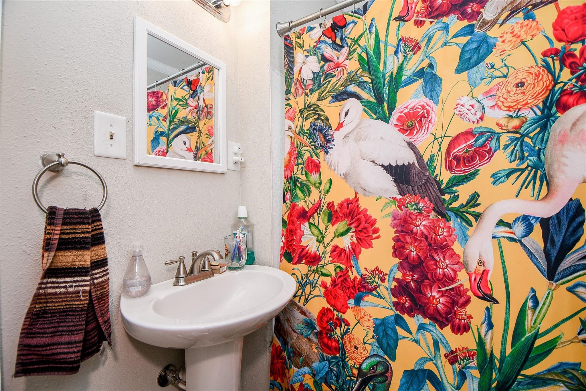 5221 Darling Street Houston, TX 77007 - Photo 7 of 22 a bathroom with a sink and a mirror