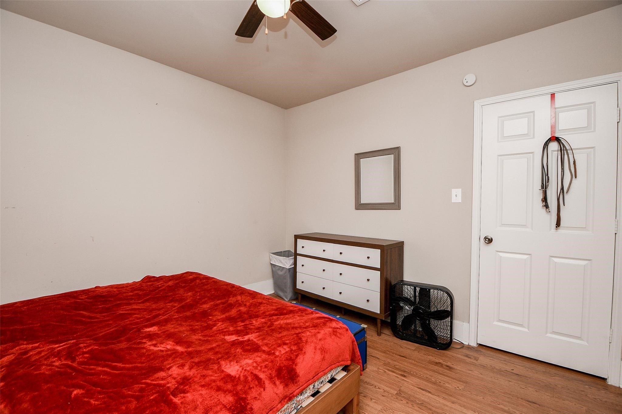 5221 Darling Street Houston, TX 77007 - Photo 10 of 22 a bedroom with a bed and a closet
