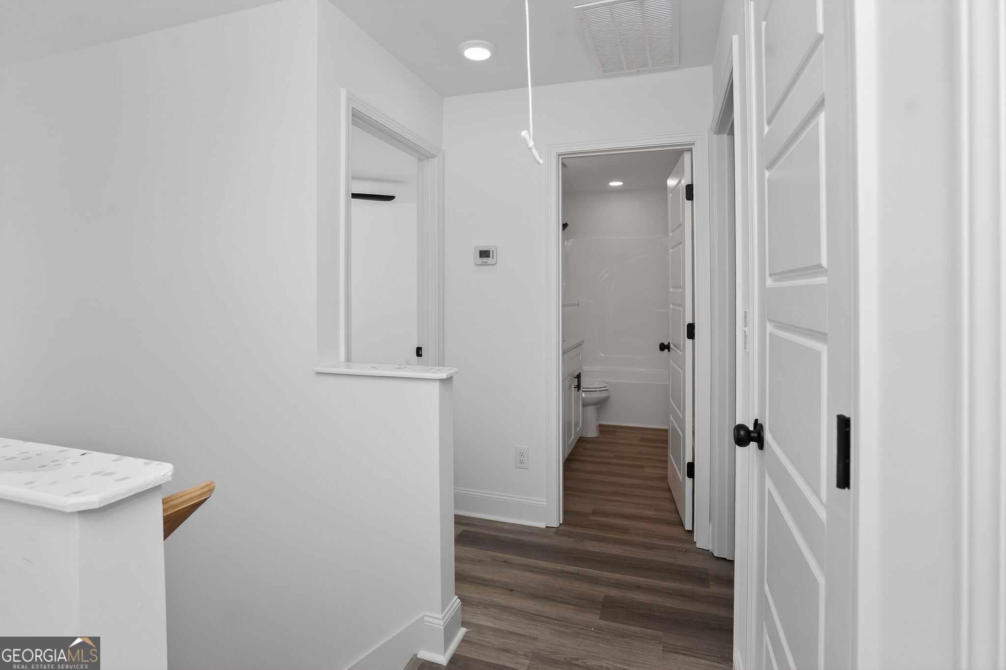 1229 Chappell Mill Road Jackson, GA 30233 - Photo 36 of 55 a view of a hallway with wooden floor and closet area