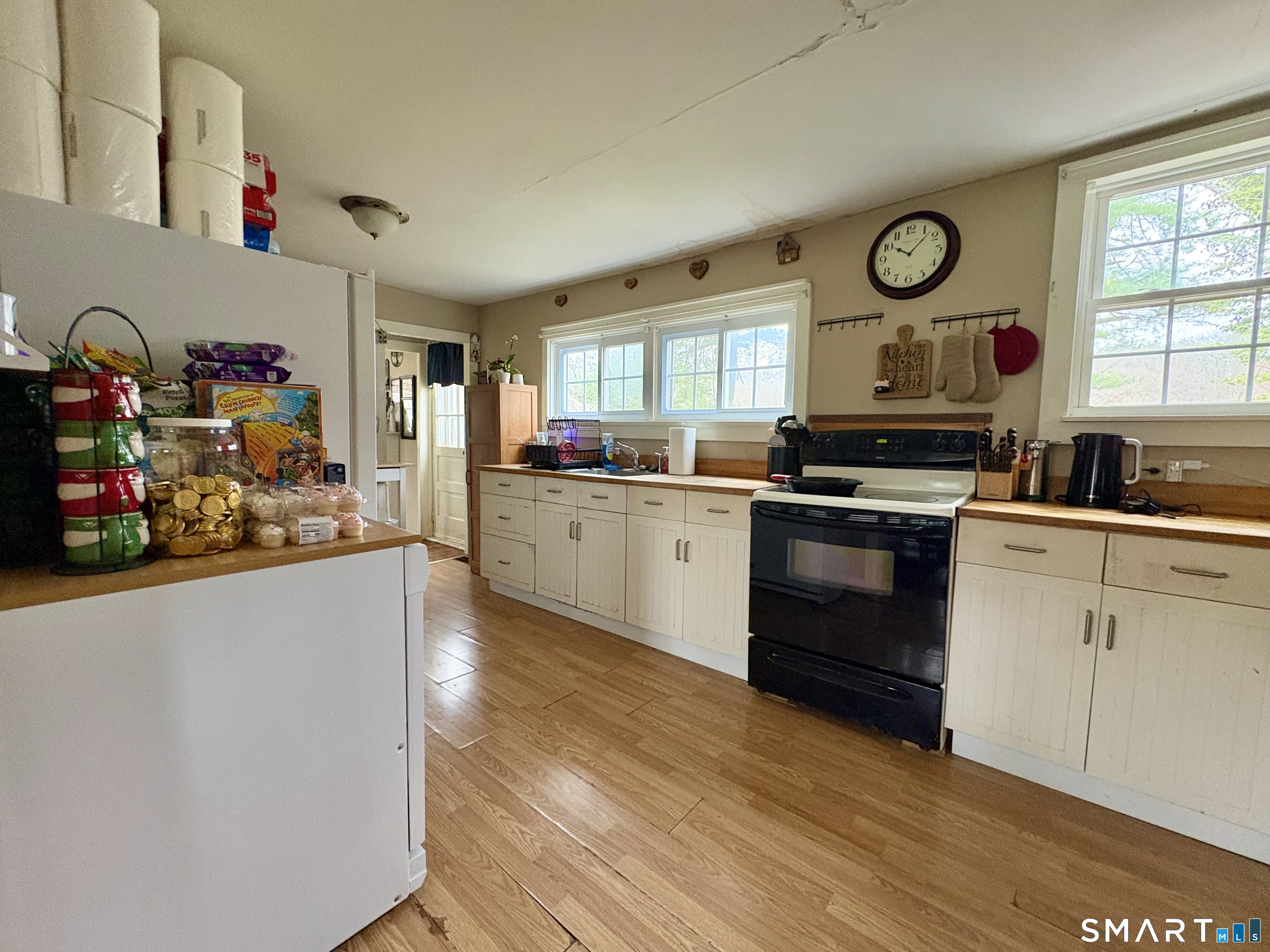 279 River Road Putnam, CT 06260 - Photo 10 of 18 a kitchen with stainless steel appliances granite countertop a stove and cabinets