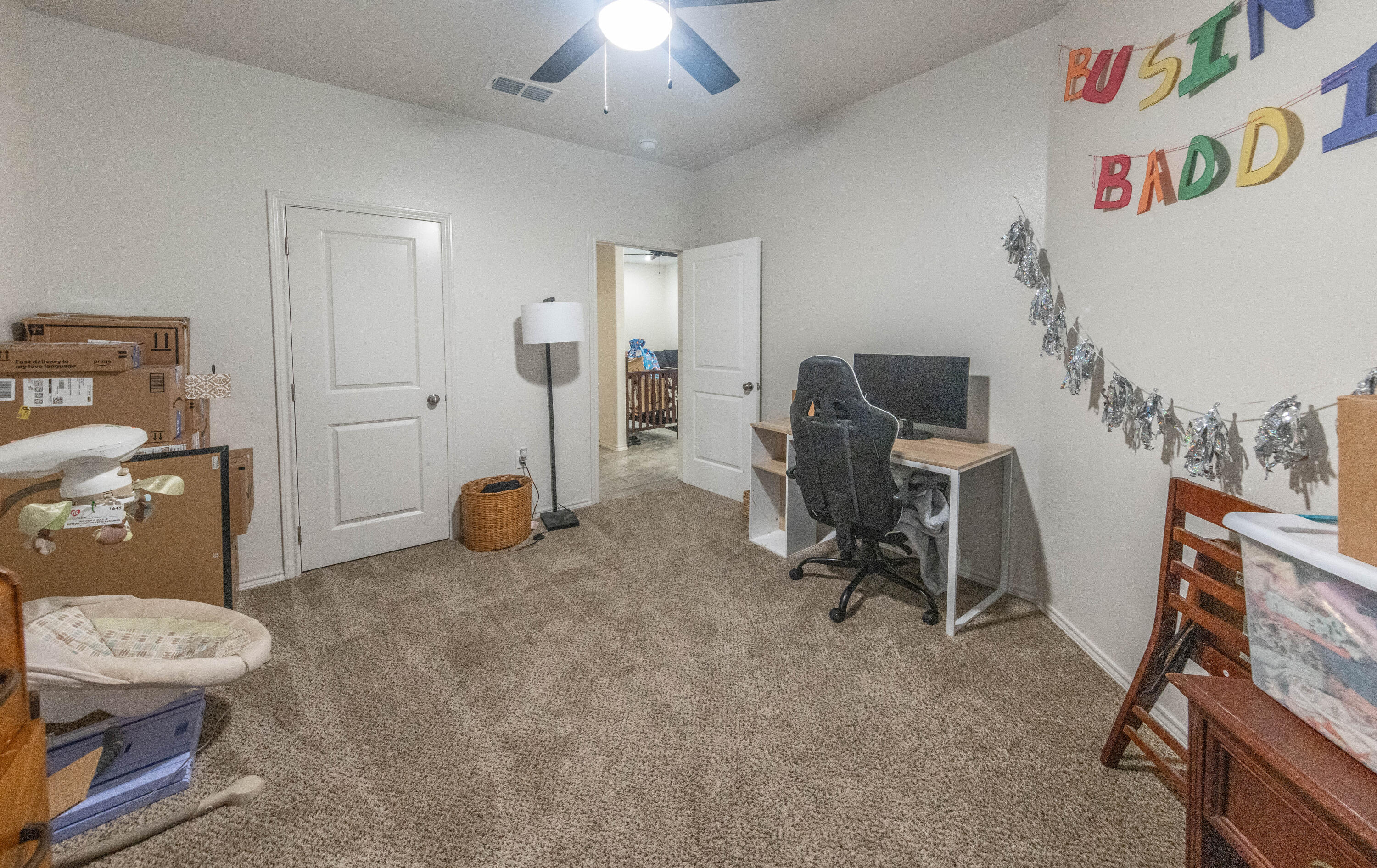 5510 Lehigh Street Lubbock, TX 79416 - Photo 15 of 32 a view of a workspace with furniture and a fan