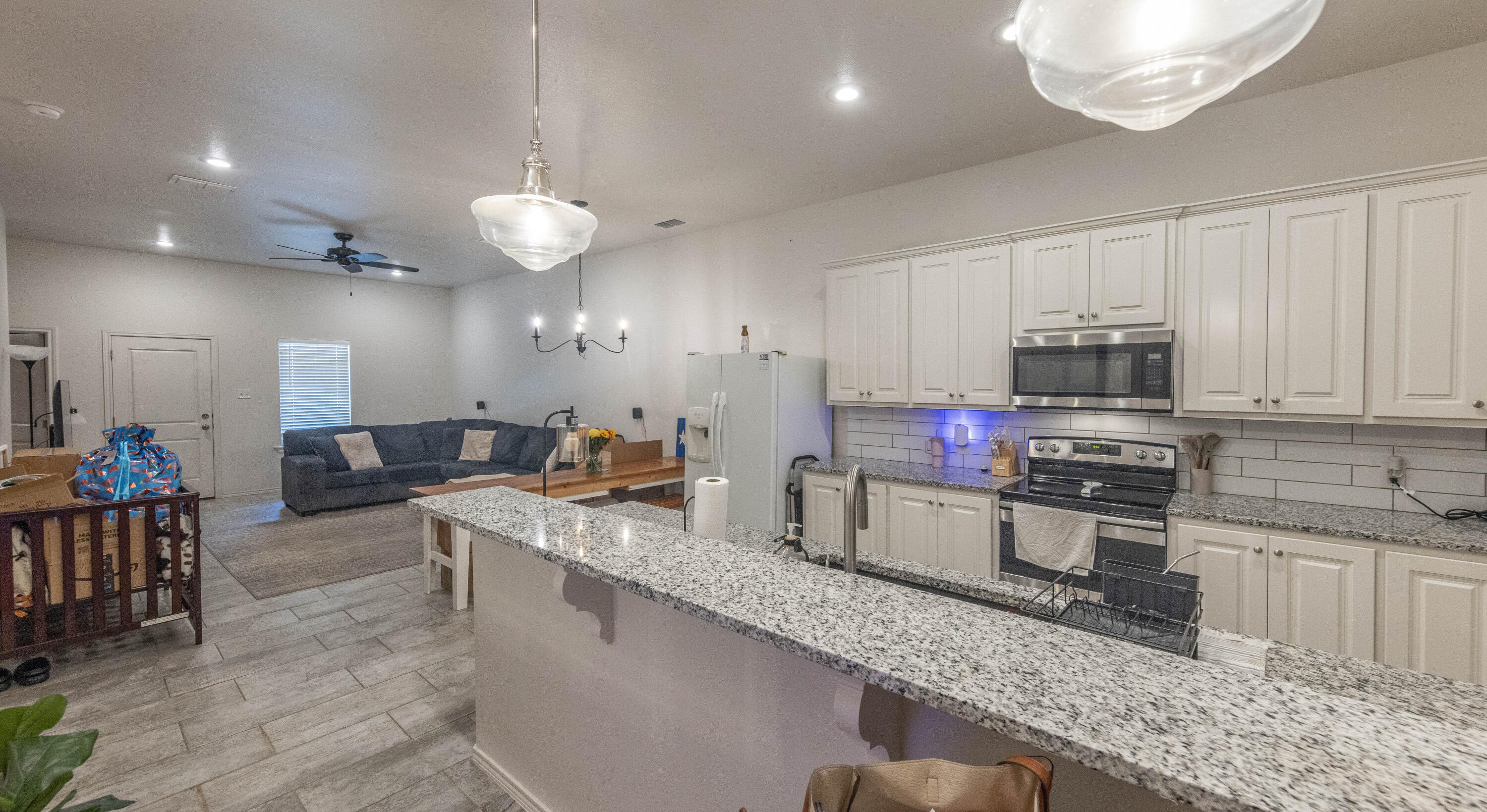 5510 Lehigh Street Lubbock, TX 79416 - Photo 5 of 32 a large kitchen with lots of counter space and stainless steel appliances