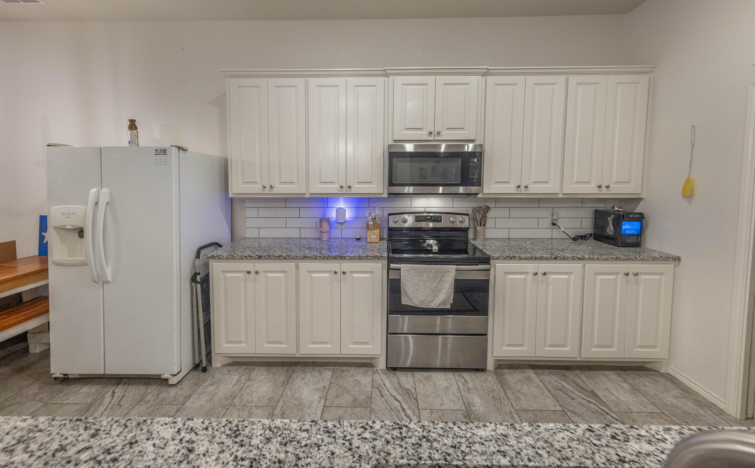 5510 Lehigh Street Lubbock, TX 79416 - Photo 6 of 32 a kitchen with appliances a sink and cabinets