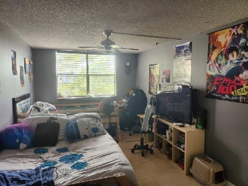2501 Riverside Drive, Unit 417A Coral Springs, FL 33065 - Photo 8 of 8 a bedroom with a bed and a window