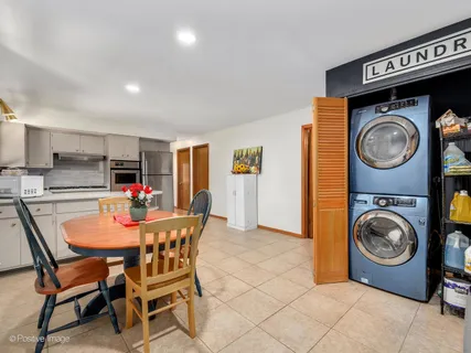 a dining room with furniture and a clock