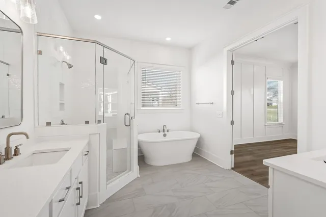 a bathroom with a sink a vanity and a mirror