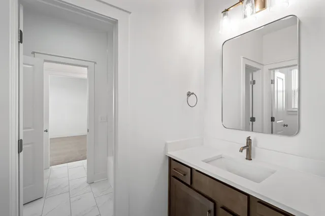 a bathroom with a sink a toilet and a bathtub