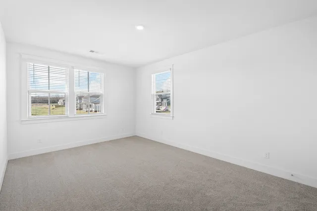 a view of empty room with windows