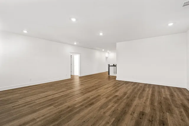 a view of a brick house that has glass windows