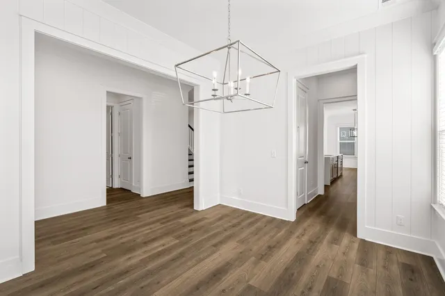 a kitchen with kitchen island a sink appliances and cabinets