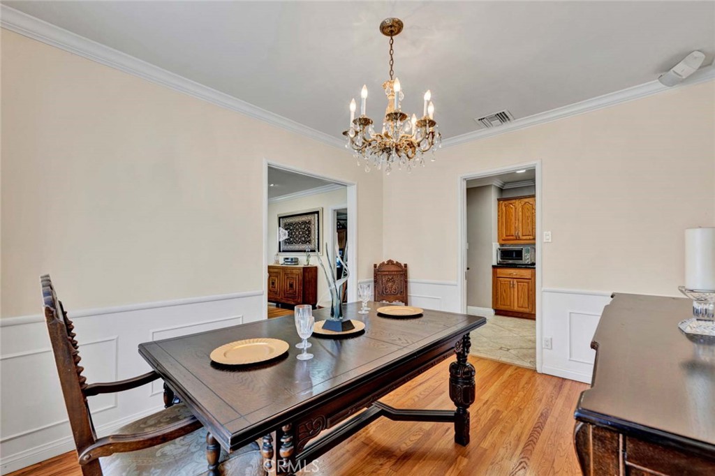 5456 Cadbury Road Whittier, CA 90601 - Photo 22 of 67 a view of a dining room with furniture and wooden floor