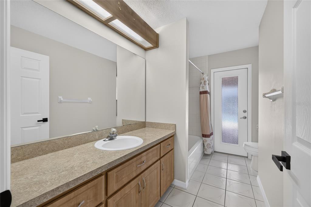 19025 Southwest 98th Loop Dunnellon, FL 34432 - Photo 41 of 80 a bathroom with a sink double vanity and a mirror