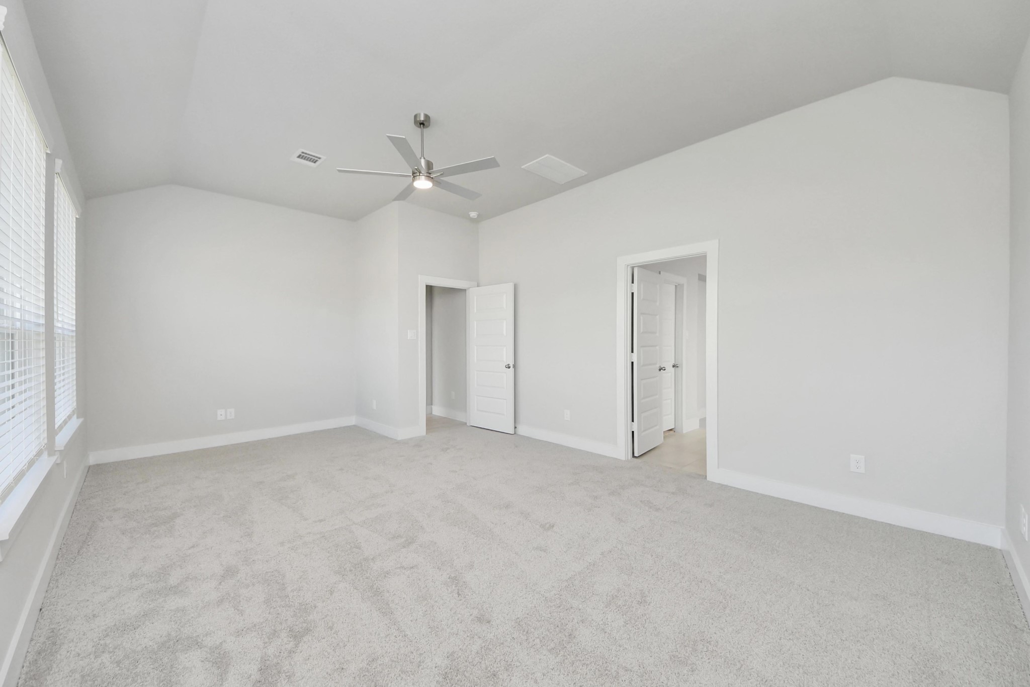 3042 Native Spg Drive Spring, TX 77373 - Photo 22 of 32 Escape to tranquility in this spacious primary room, adorned with plush carpeting and bathed in the soothing hues of warm paint colors, creating a cozy retreat for relaxation. Sample photo of completed home with similar floor plan. Actual colors and selections may vary.