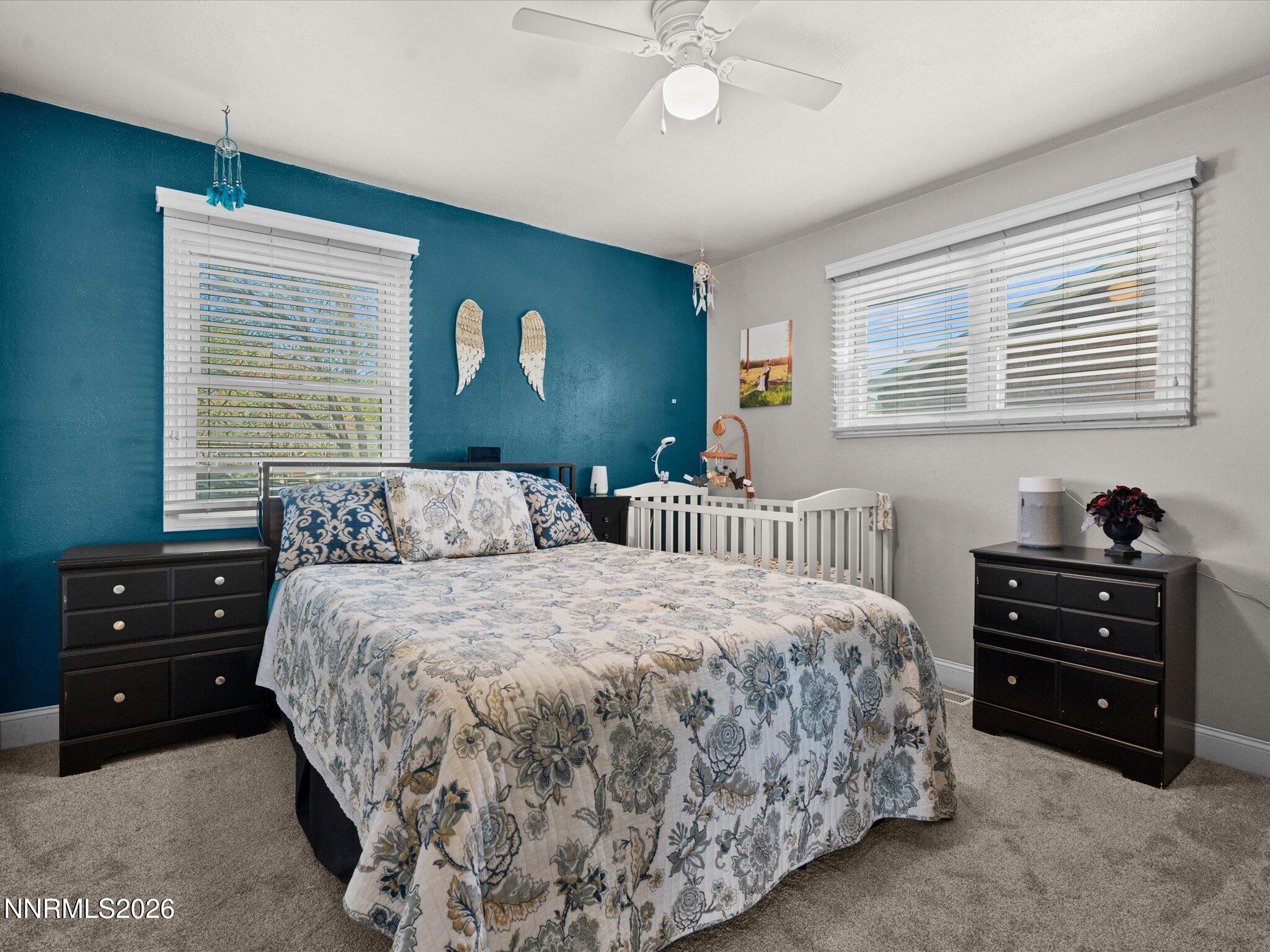 1030 4th Street Sparks, NV 89431 - Photo 12 of 26 a bedroom with a bed and a dresser