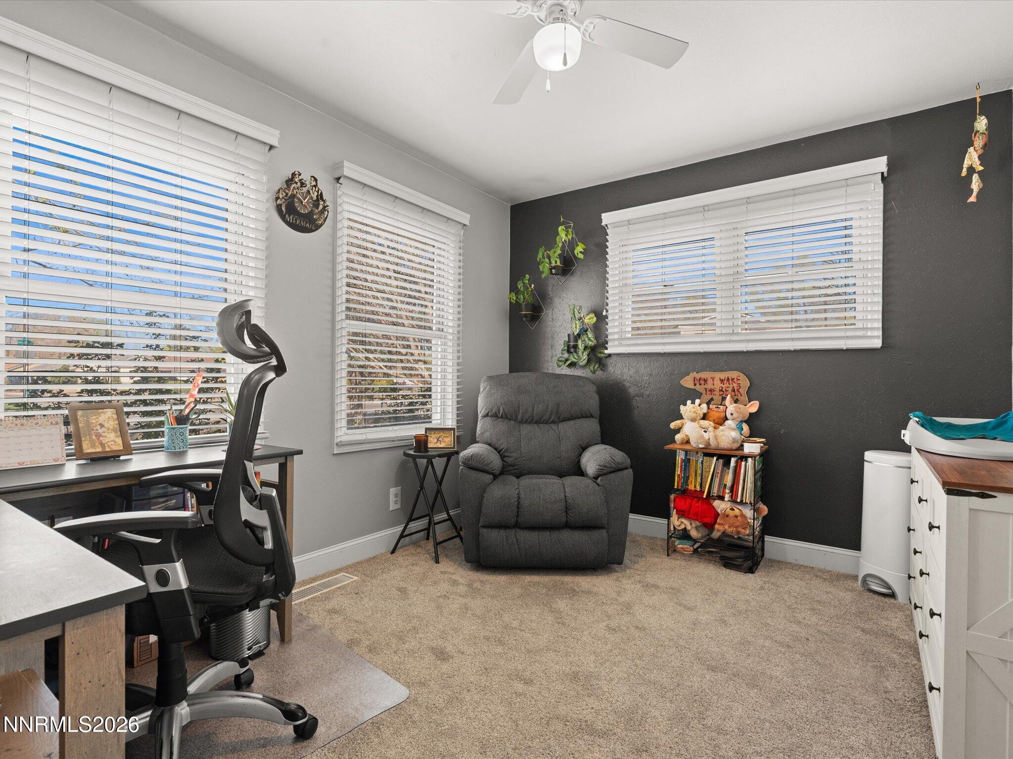 1030 4th Street Sparks, NV 89431 - Photo 21 of 26 a living room with furniture and a window