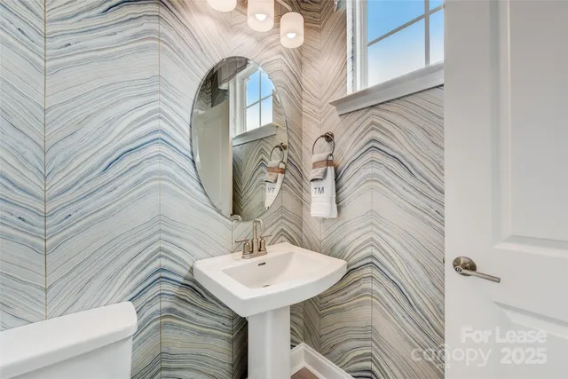 a spacious bedroom with a bed and a large window