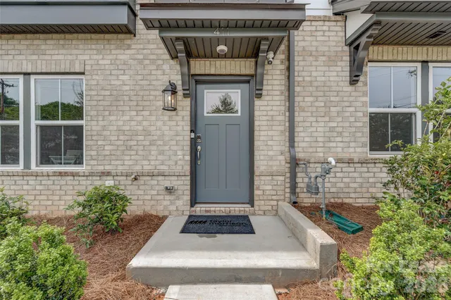a large kitchen with a table and chairs