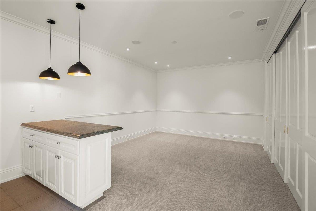 14113 Pike Road Saratoga, CA 95070 - Photo 54 of 78 a kitchen with a stove a refrigerator a sink and white cabinets