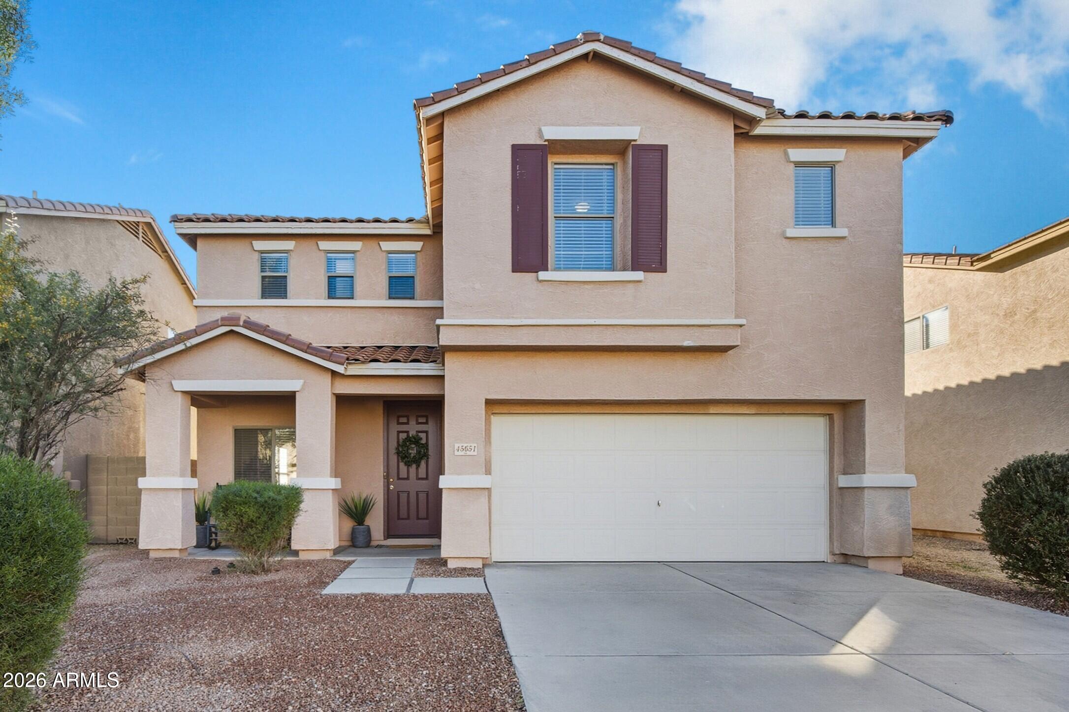 45651 West Barbara Lane Maricopa, AZ 85139 - Photo 1 of 32 a front view of a house with a yard and garage