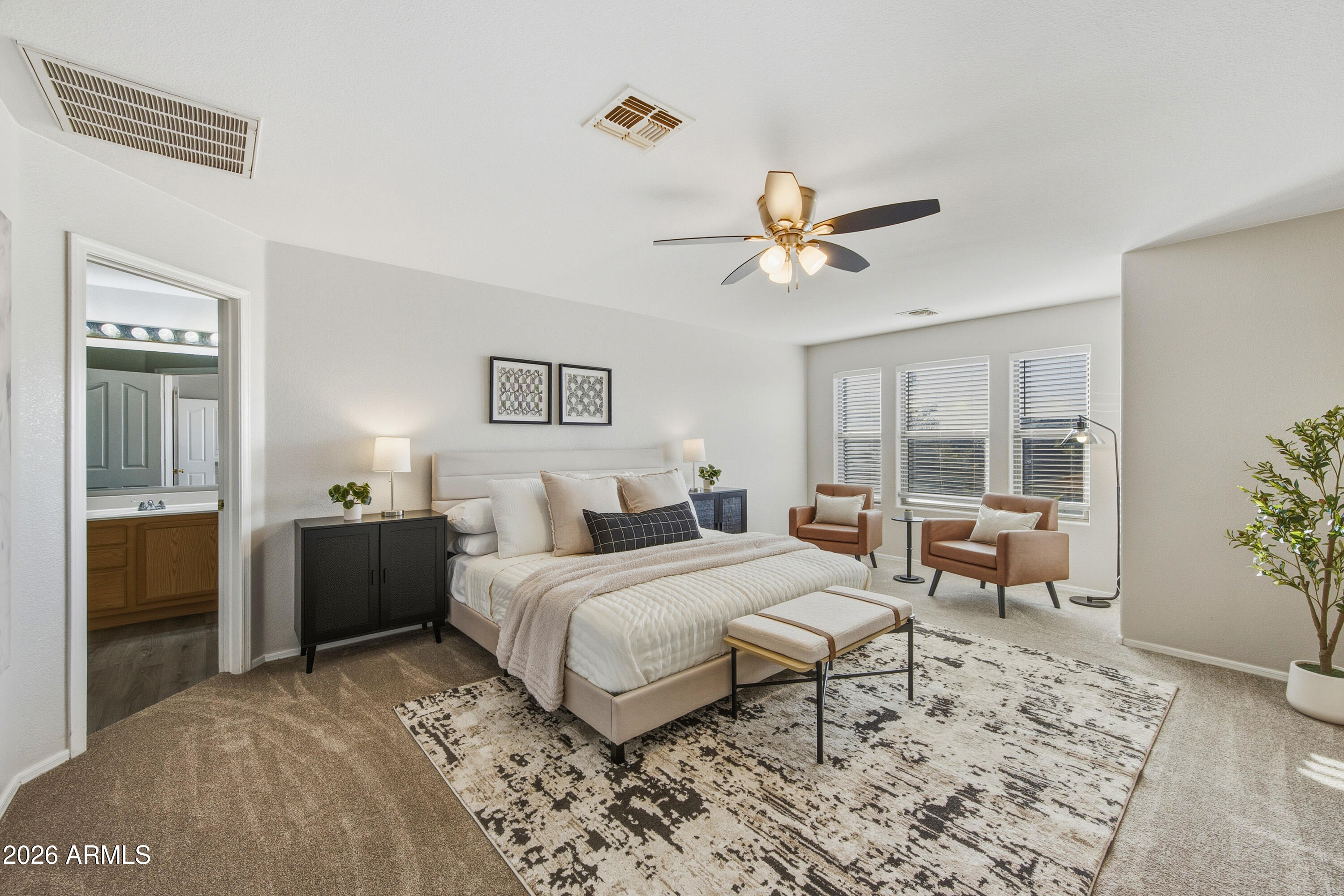 45651 West Barbara Lane Maricopa, AZ 85139 - Photo 13 of 32 a bedroom with a bed and a chandelier