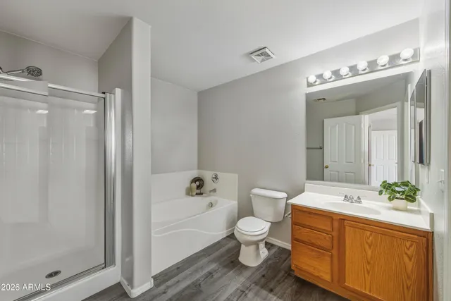 a bathroom with a sink a toilet and bathtub