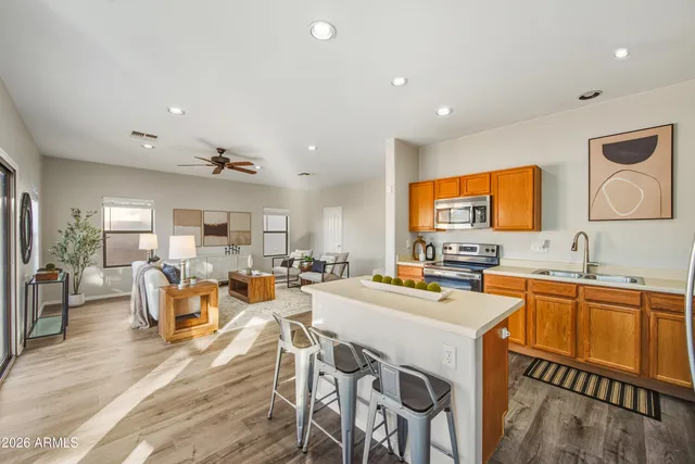 a large kitchen with a table and chairs