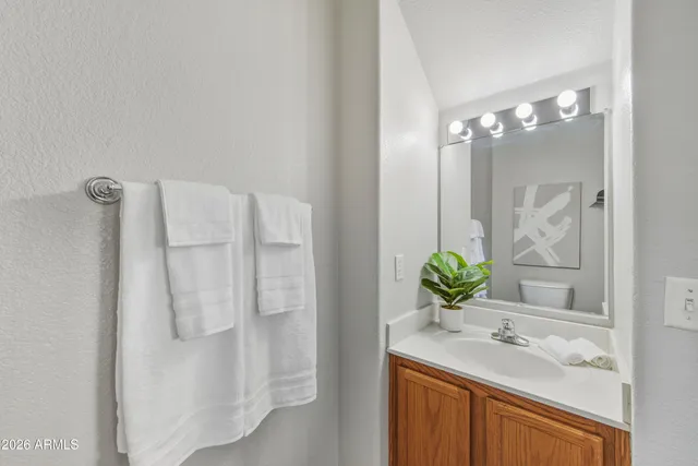 a bathroom with a sink a toilet and tub