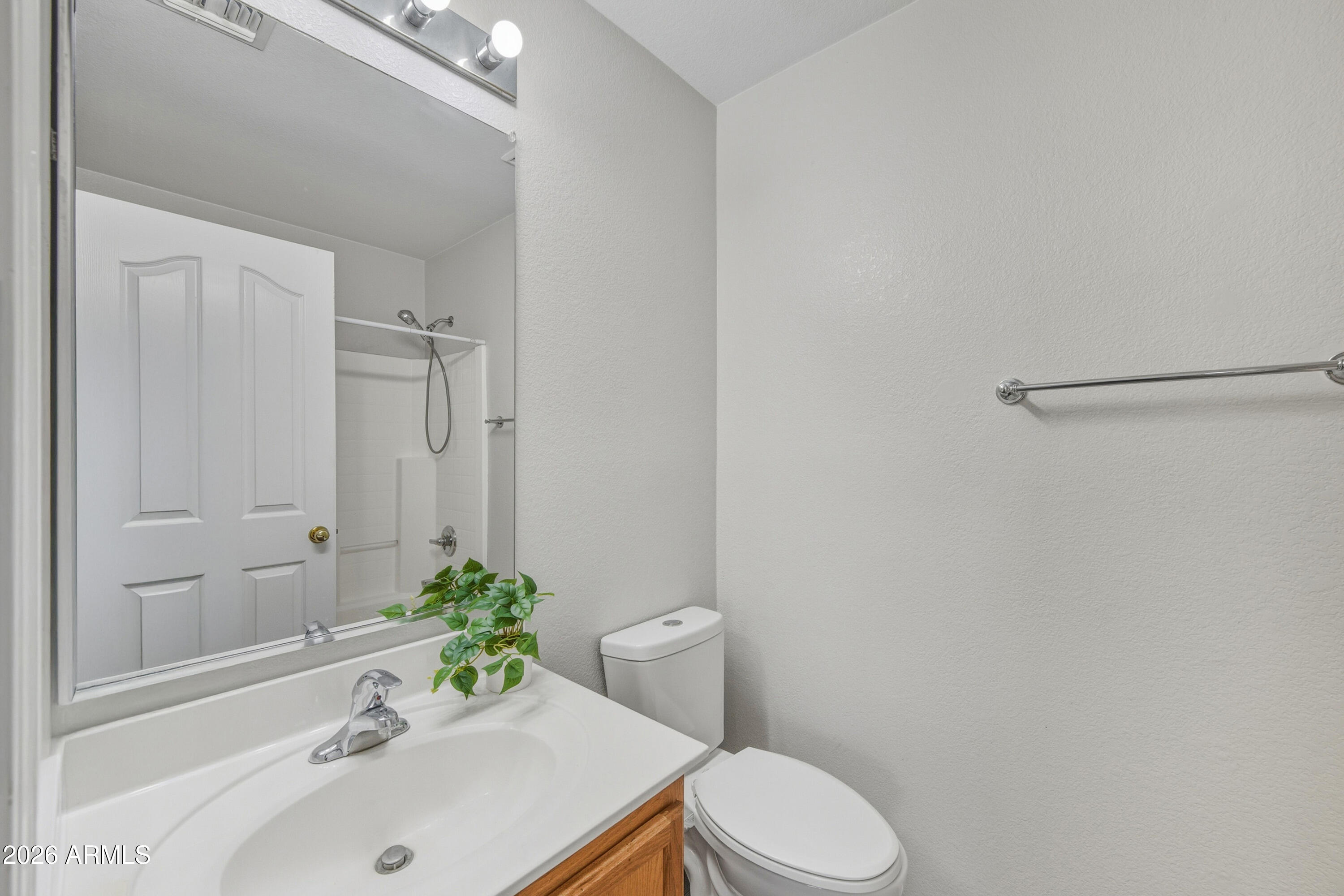 45651 West Barbara Lane Maricopa, AZ 85139 - Photo 23 of 32 a bathroom with a sink a toilet and tub
