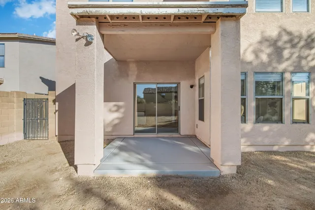 a view of a house with a backyard