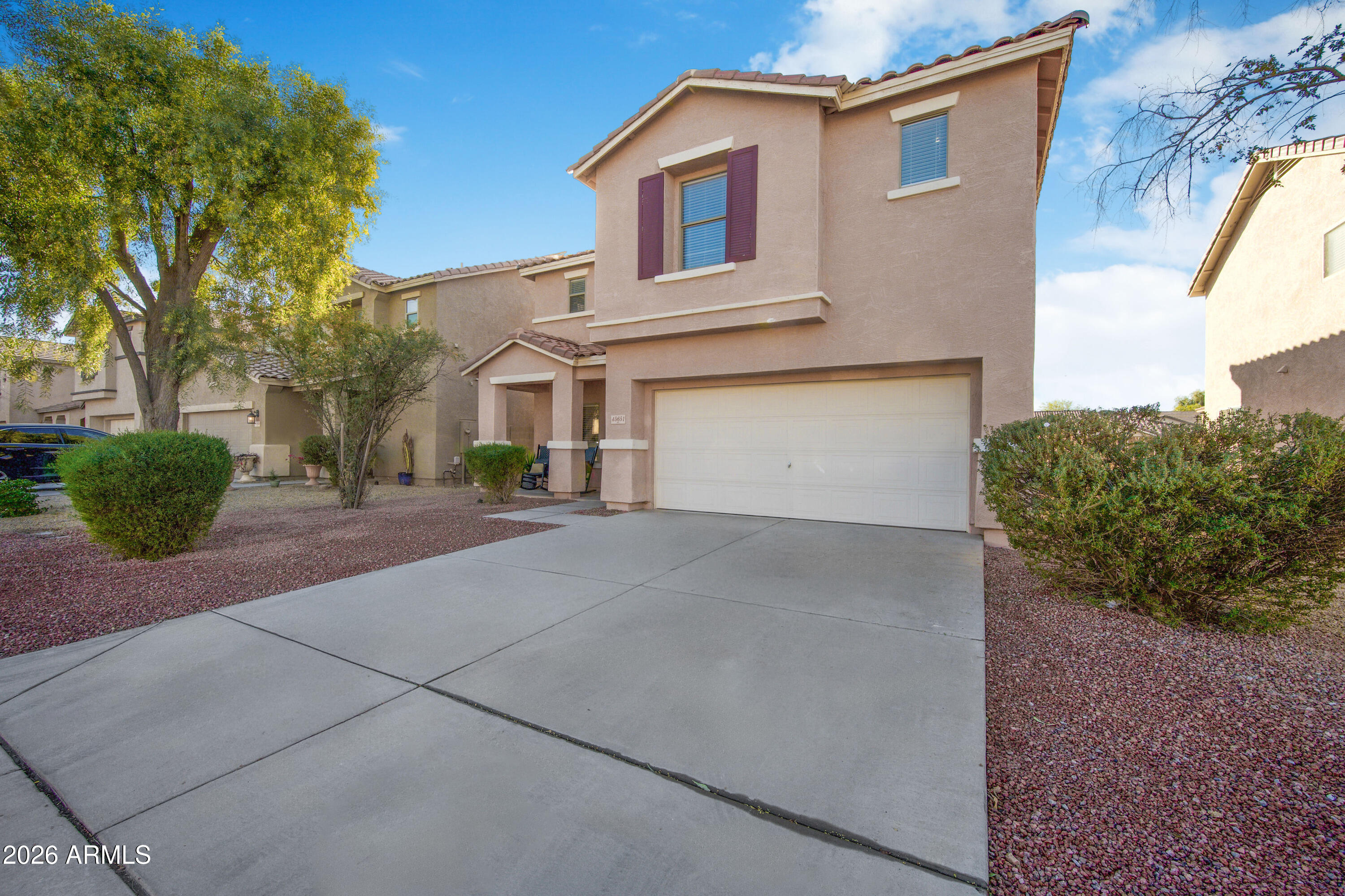 45651 West Barbara Lane Maricopa, AZ 85139 - Photo 28 of 32 a front view of a house with a yard and garage