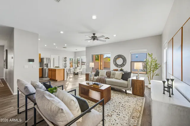a living room with furniture and a large window
