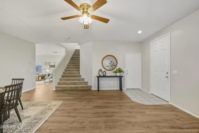 a view of an entryway and wooden floor