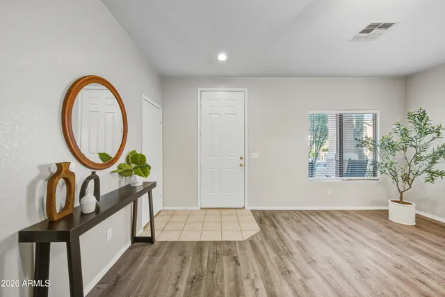 a view of an entryway with wooden floor