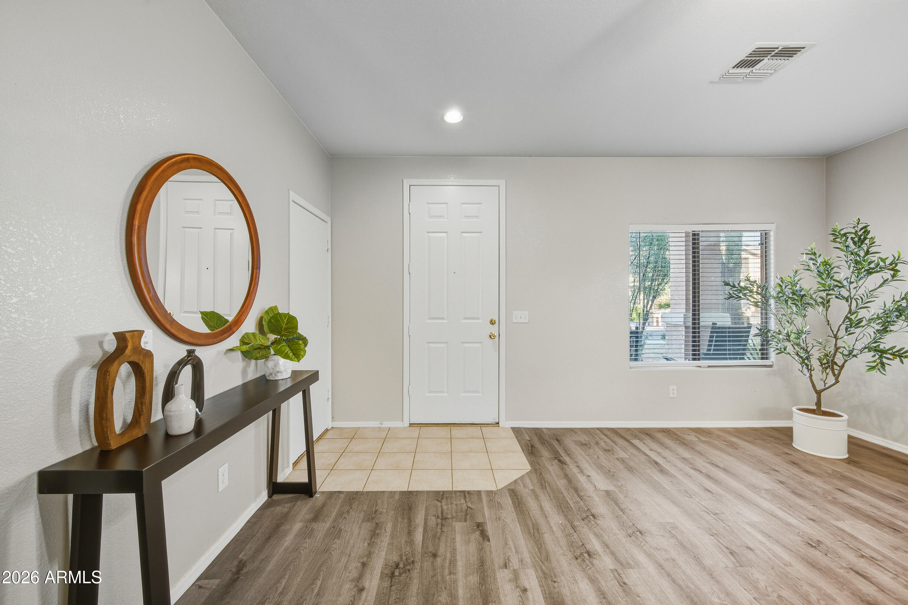 45651 West Barbara Lane Maricopa, AZ 85139 - Photo 6 of 32 a view of an entryway with wooden floor
