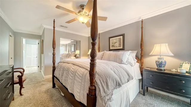 a bedroom with two beds and a large window