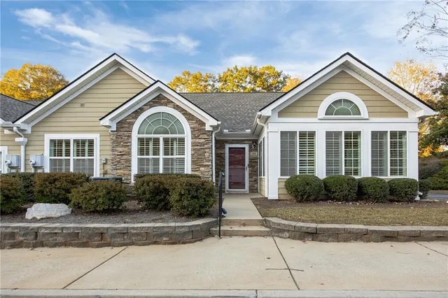 a front view of a house with a yard