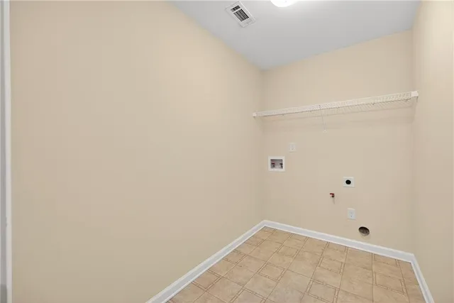 a spacious bathroom with a granite countertop toilet a sink and a mirror