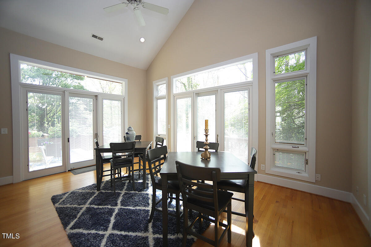 1108 Hymettus Court Raleigh, NC 27607 - Photo 14 of 48 a view of a dining room with furniture window and wooden floor