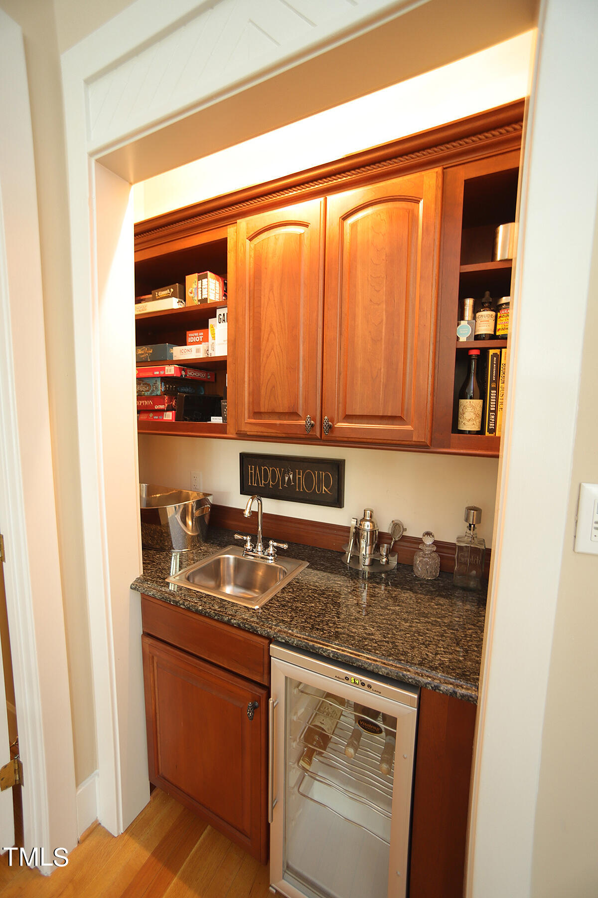 1108 Hymettus Court Raleigh, NC 27607 - Photo 18 of 48 a kitchen with stainless steel appliances granite countertop a sink and cabinets