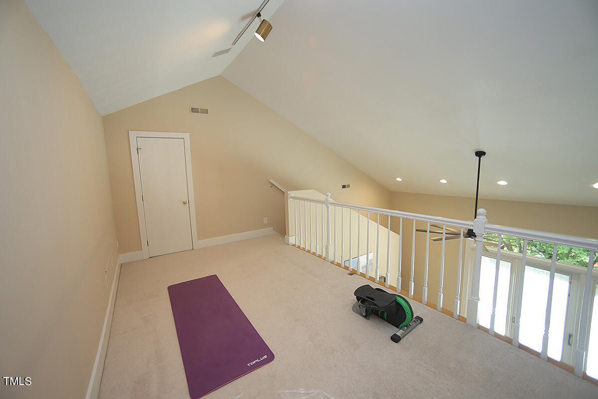 1108 Hymettus Court Raleigh, NC 27607 - Photo 21 of 48 a room with stairs and a rug