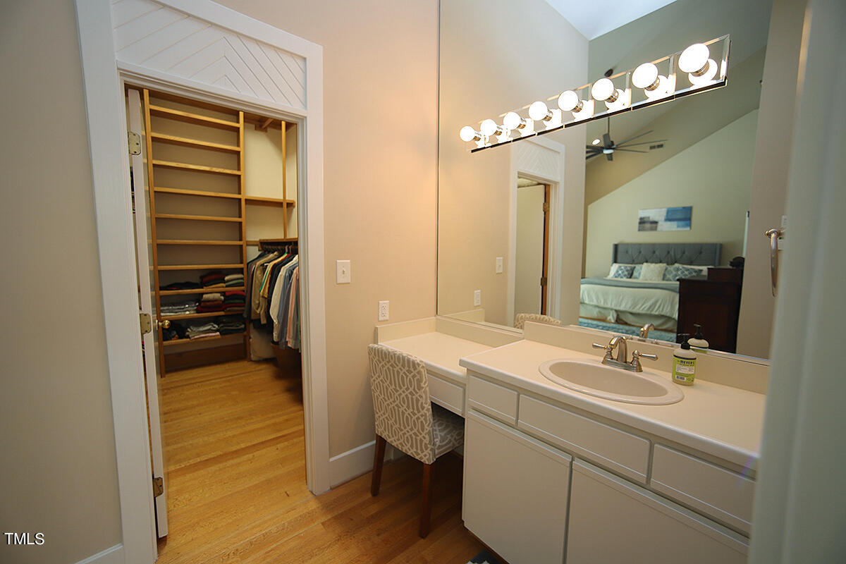 1108 Hymettus Court Raleigh, NC 27607 - Photo 23 of 48 a en suite bathroom with a sink a mirror and a shower