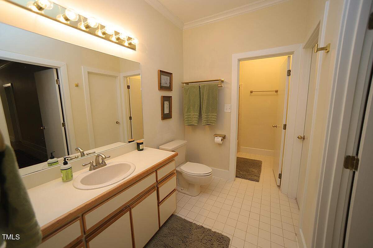 1108 Hymettus Court Raleigh, NC 27607 - Photo 35 of 48 a bathroom with a sink a toilet and shower
