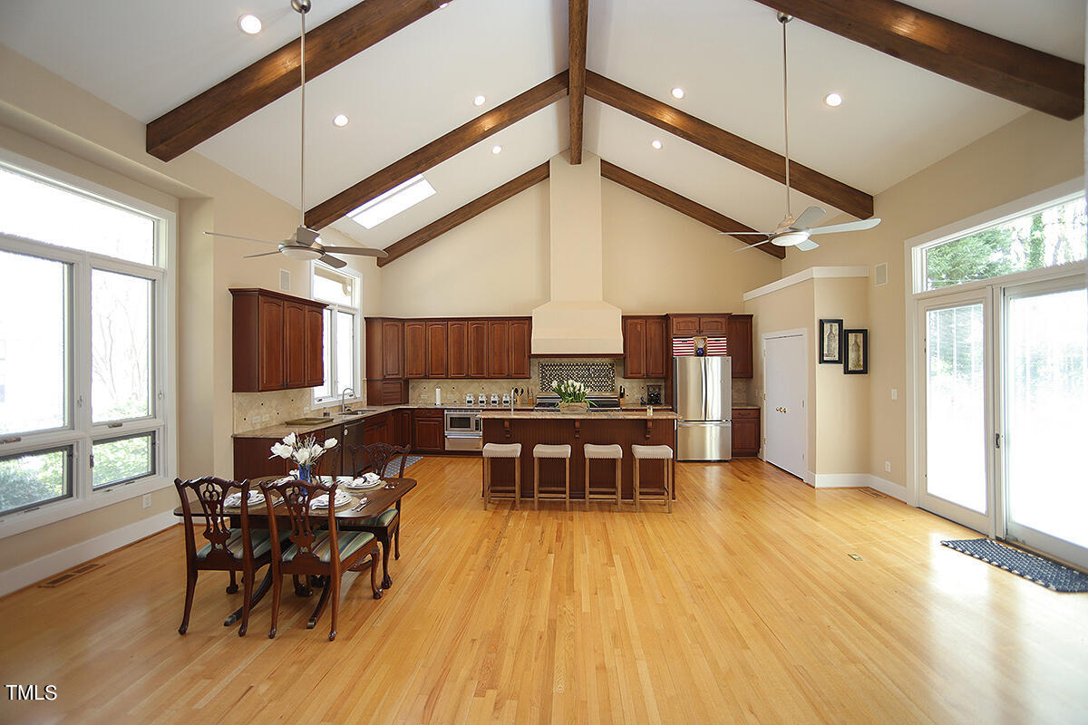 1108 Hymettus Court Raleigh, NC 27607 - Photo 5 of 48 a view of a dining room with furniture and wooden floor