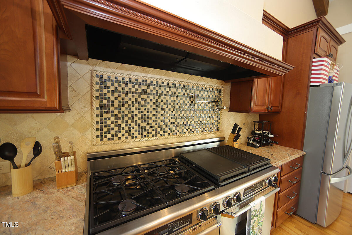 1108 Hymettus Court Raleigh, NC 27607 - Photo 7 of 48 a close view of a stove and a microwave oven