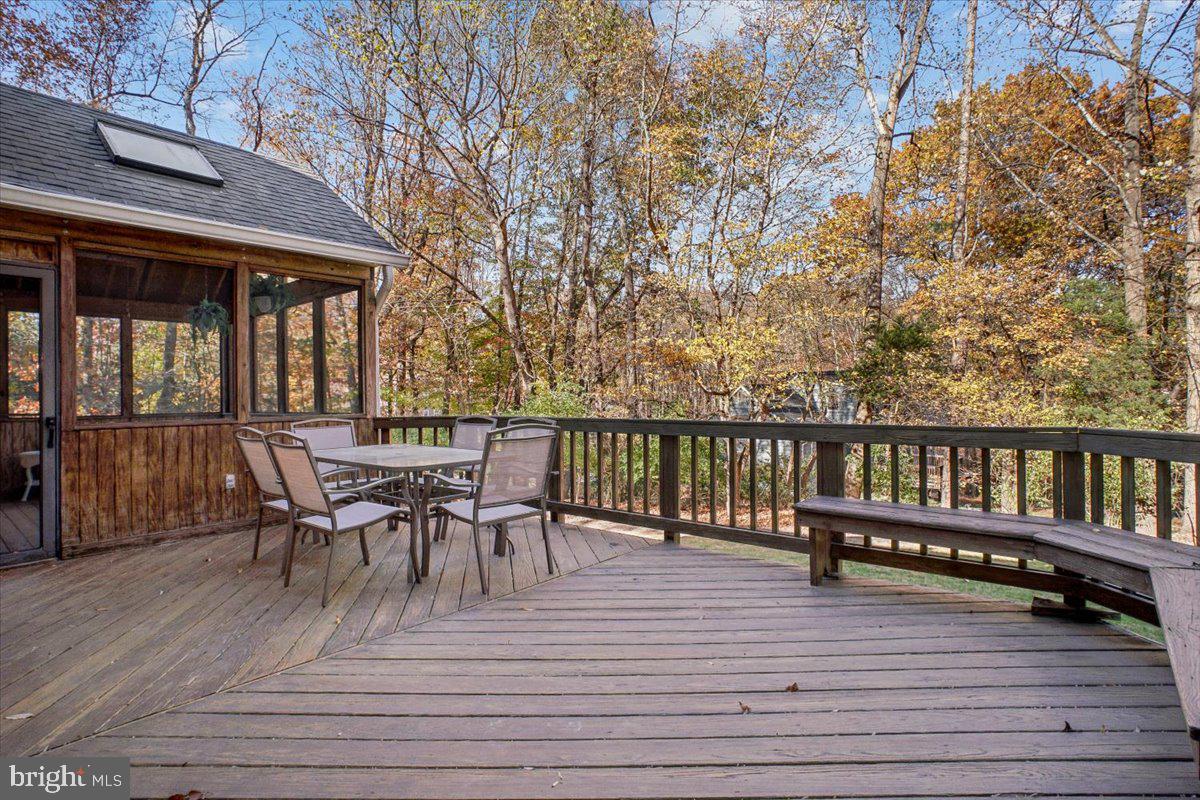 3105 Miller Heights Road Oakton, VA 22124 - Photo 15 of 60 a view of a house with wooden deck and furniture