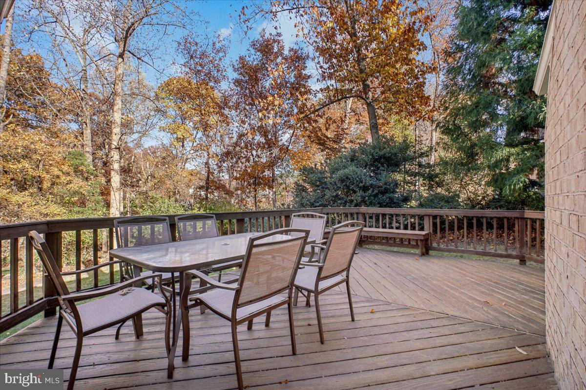 3105 Miller Heights Road Oakton, VA 22124 - Photo 16 of 60 a view of a chairs and table on the wooden floor