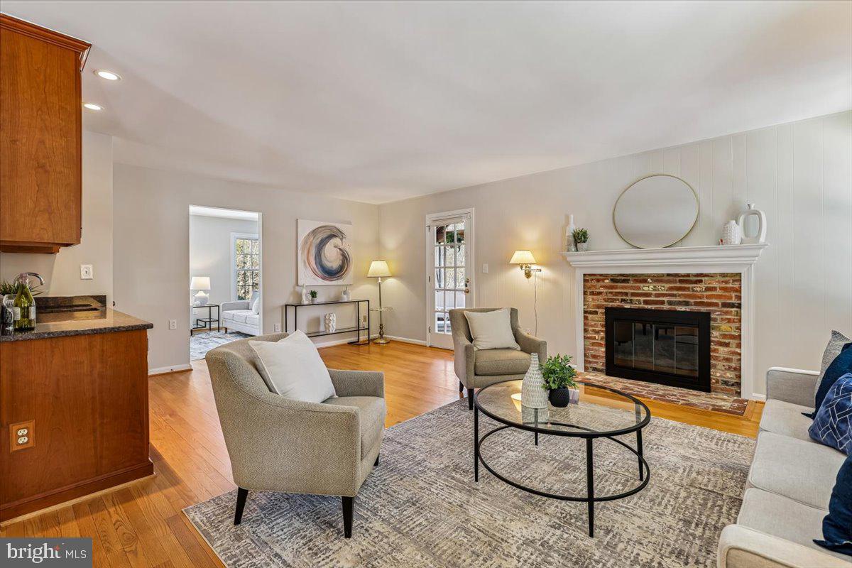 3105 Miller Heights Road Oakton, VA 22124 - Photo 18 of 60 Large family room has an inviting gas fireplace.